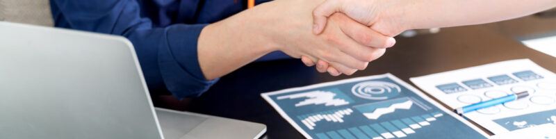 Selective focus young man handshake with someone at office